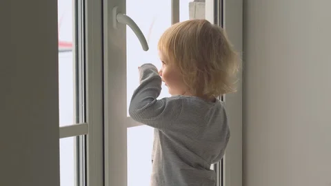Baby looking out the window